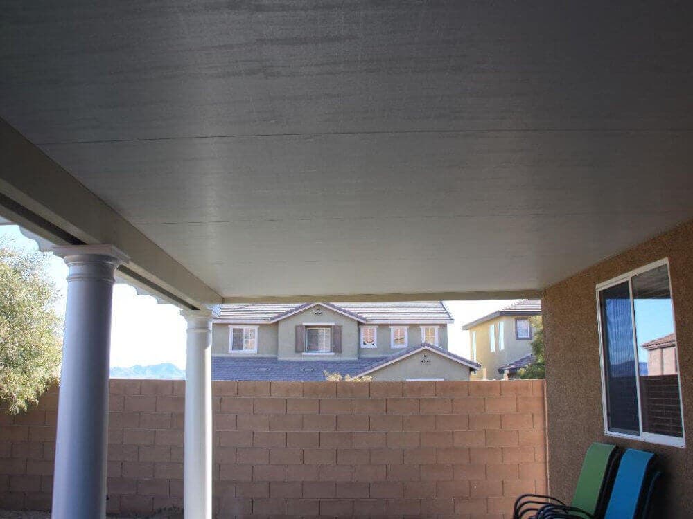Insulated patio cover over a backyard patio