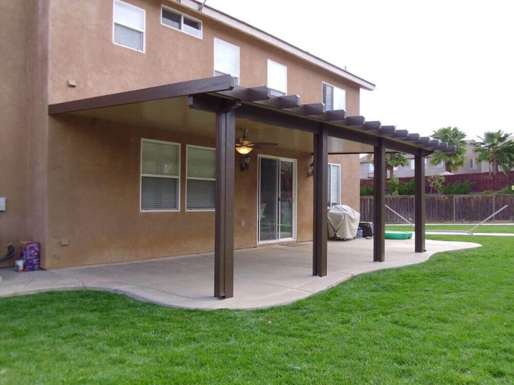 Solid patio cover over a lawn-side patio