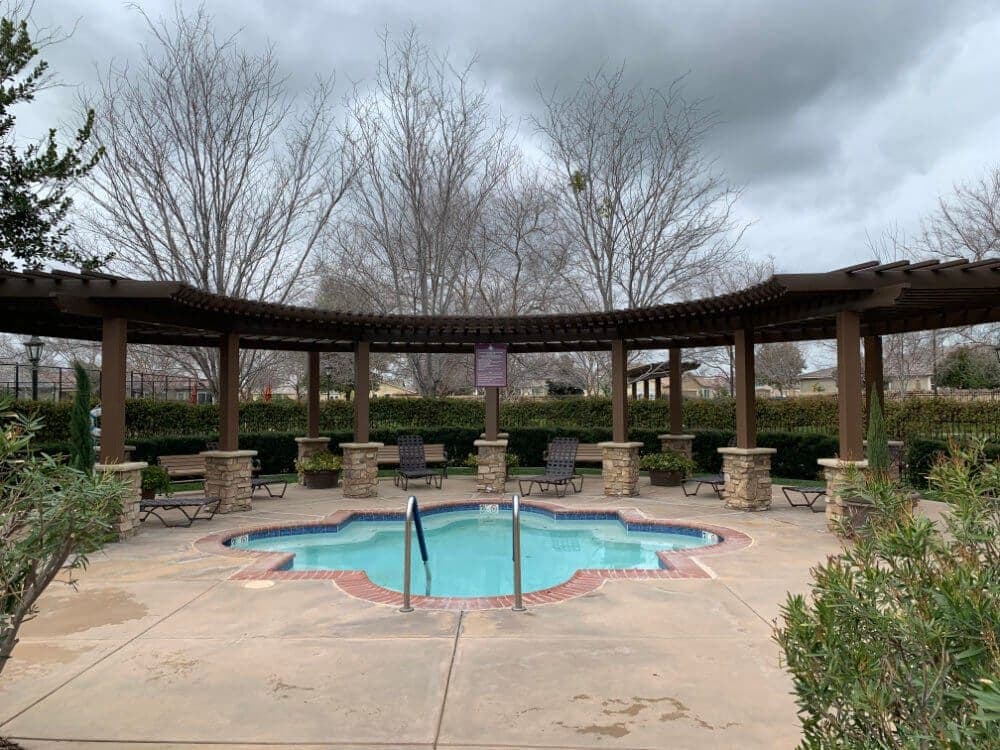 Freestanding lattice cover beside a pool
