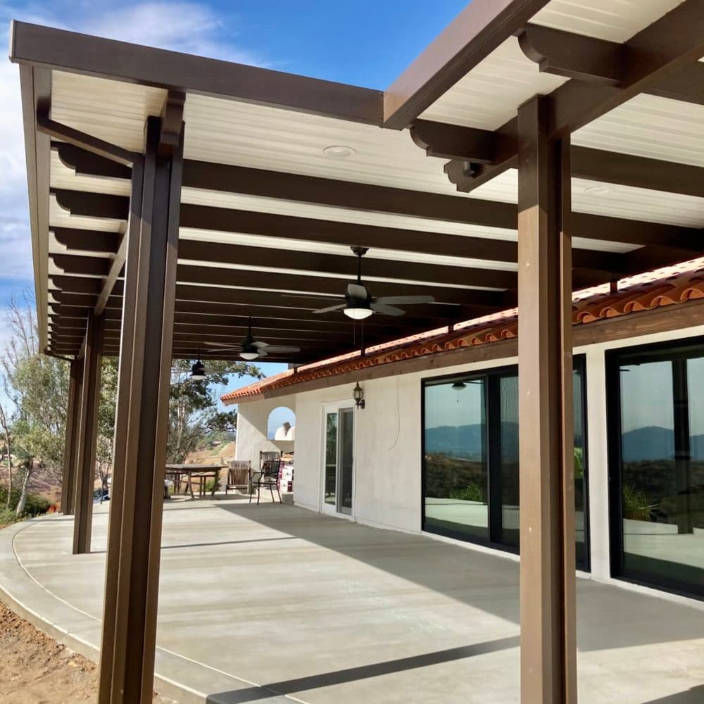 Spanish brown Alumawood solid cover with ceiling fans over a long patio